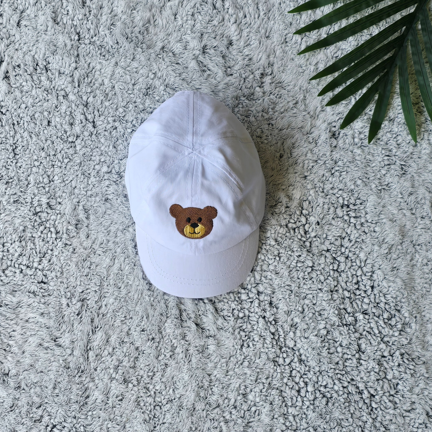 White embroidered teddy bear cap for baby boys