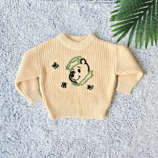 Knitted sweater for baby boy with embroidered bear